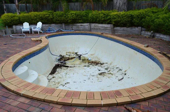 Marblesheen pool with waterline tiles before full retiling renovation