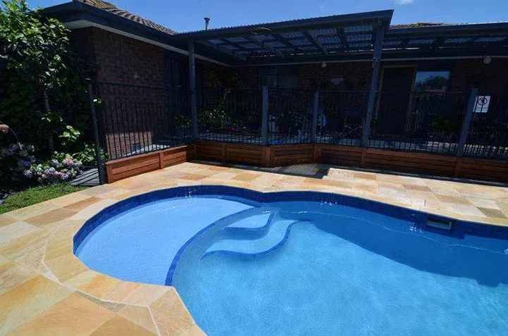 Quartzon pool resurfacing in Melbourne — completed with new coping, paving and bamboo screening