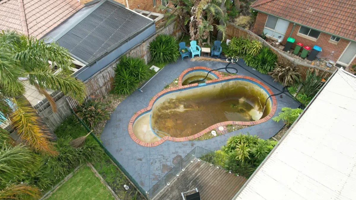 Abandoned swimming pool before restoration