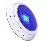Blue LED pool light illuminating swimming pool at night