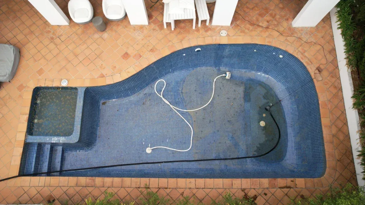 Old Brighton pool with worn tiling before renovation